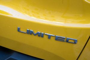 photo Limited written text on yellow Jeep