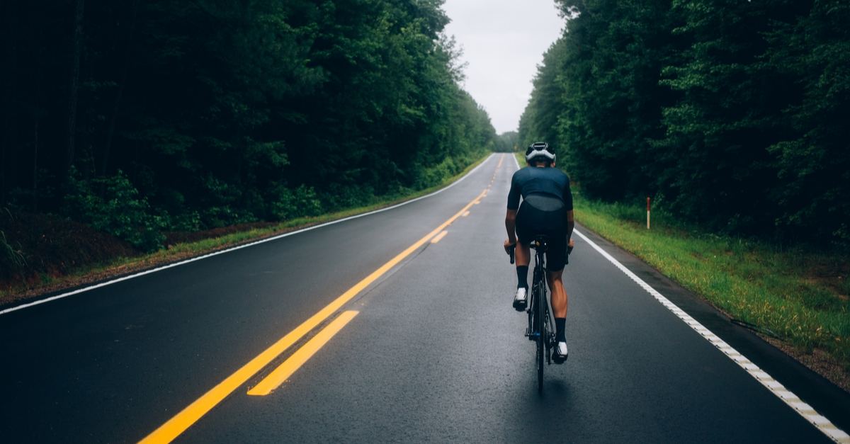 bicycle on road with trees